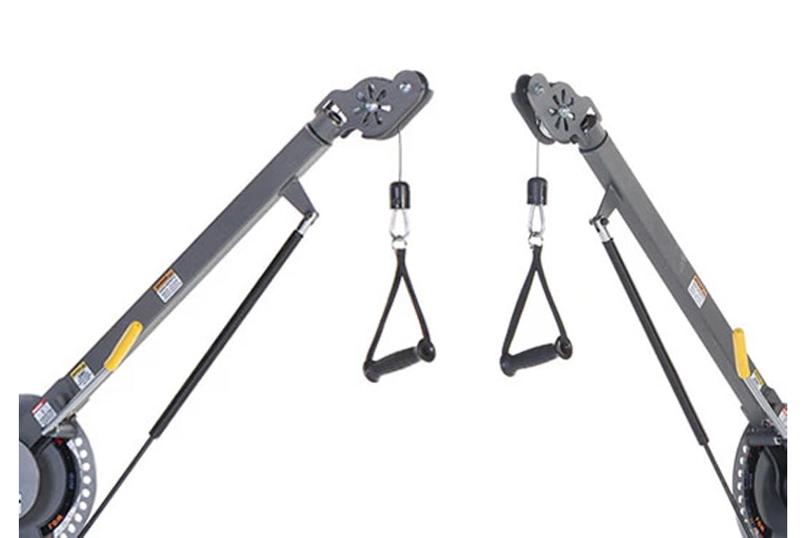 Pair of gray TuffStuff Evolution dual stack functional trainers with adjustable arms, pulleys, and black grip handles on whit