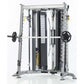 TuffStuff Evolution corner multi-functional trainer with silver frame, dual black weight plates, and integrated smith press a