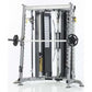 TuffStuff Evolution Corner Multi-Functional Trainer with silver frame, black weight stack, dual hand grips, and weight plates