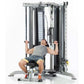 Man using silver and black cable machine trainer with dual weight stacks on white background