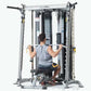 Man using silver and black multi-functional trainer with cable machine, seated on bench performing lat pulldown exercise