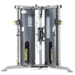 Commercial-grade dual-stack functional trainer with gray steel frame, black cylindrical weight stacks, yellow handles, and in