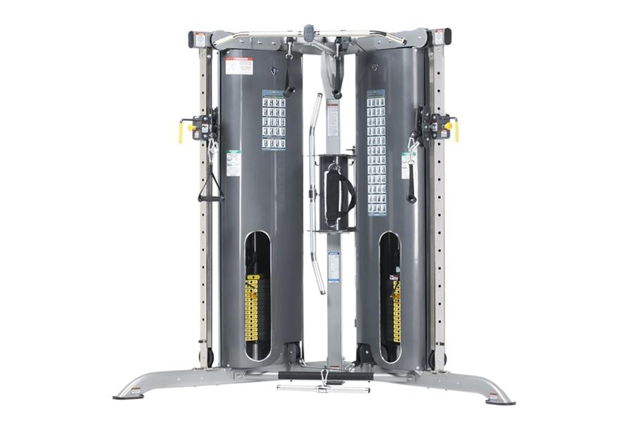 Commercial-grade dual-stack functional trainer with gray steel frame, black cylindrical weight stacks, yellow handles, and in