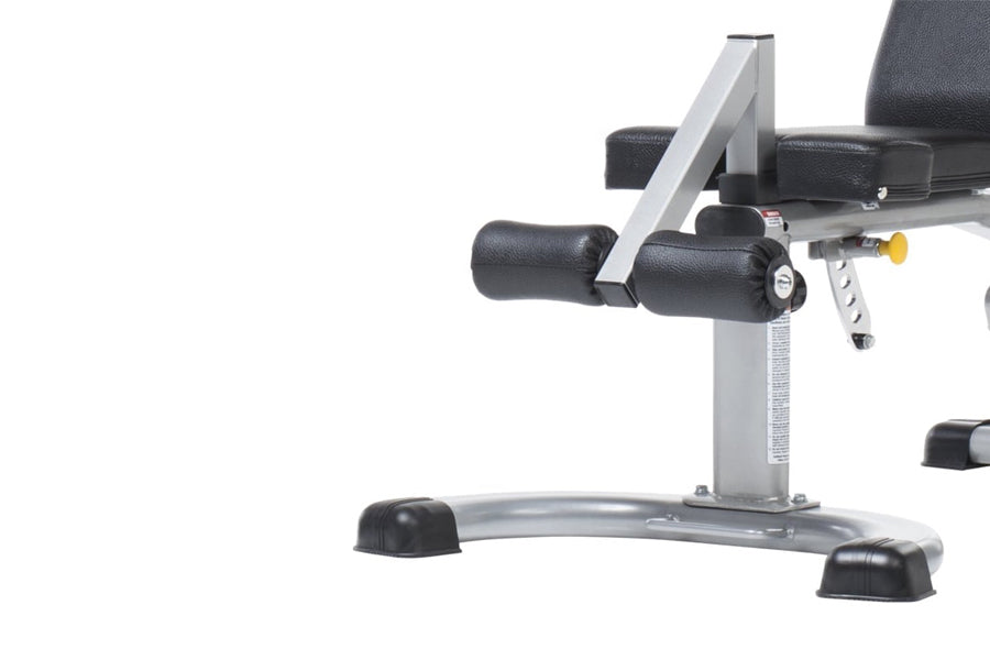 TuffStuff Evolution Deluxe Multi Purpose Bench with silver frame, black padded seat and back, adjustable leg extension, on wh