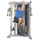 Man in blue shirt using silver and black dual adjustable pulley machine with yellow accents, demonstrating pull-up exercise o