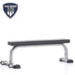 TuffStuff Evolution flat bench with black padded seat, silver metal frame, and dual stabilizer feet on white background