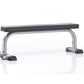 TuffStuff Evolution flat weight bench with black padded seat, silver metal frame, and black base feet on white background