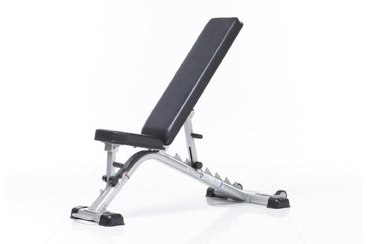 TuffStuff Evolution flat and incline weight bench with black padded seat and silver metal frame on white background