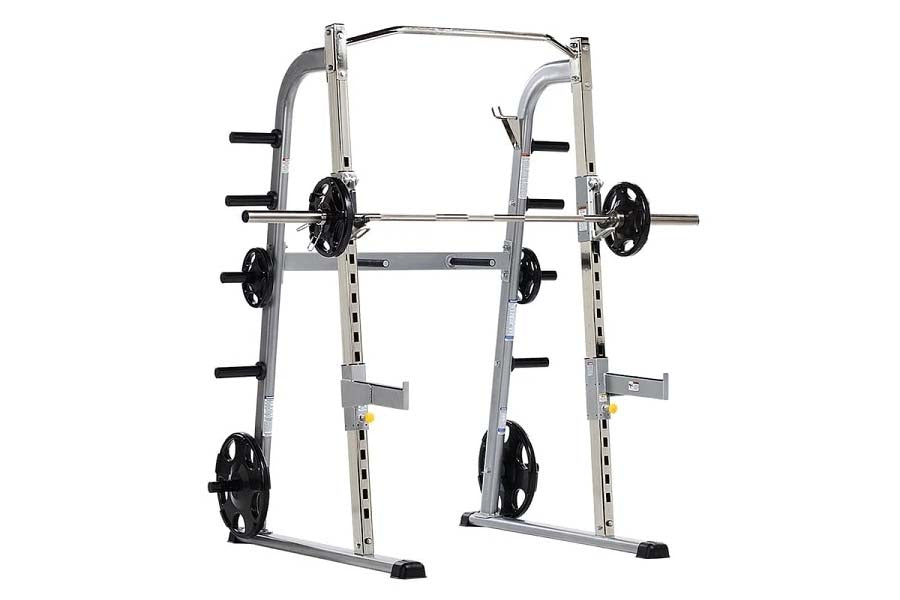 TuffStuff Evolution half cage with silver frame, black weight plates, and barbell on white background