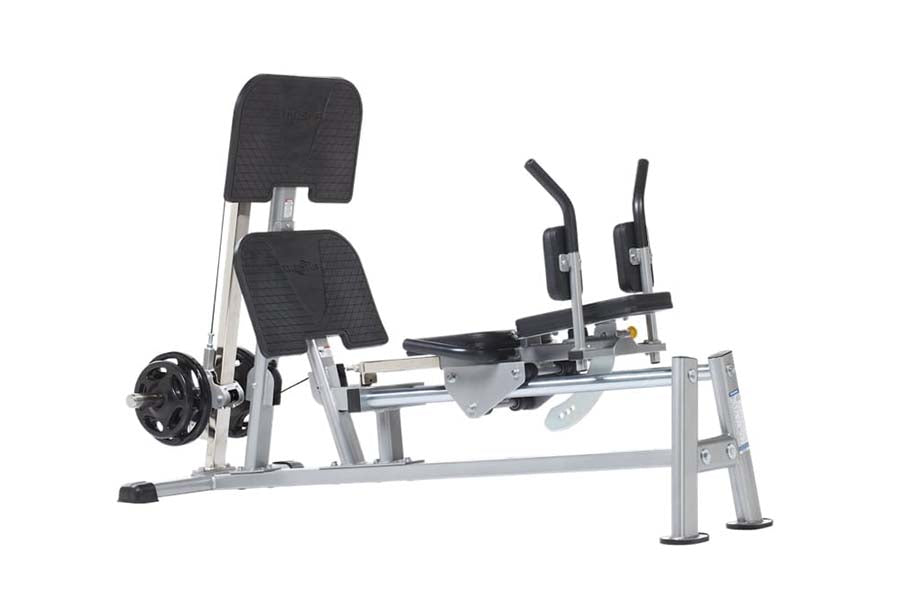 TuffStuff Evolution horizontal leg press with silver metal frame, black padded seat and backrest, dual foot pedals, and weigh