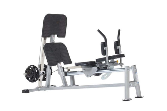 TuffStuff Evolution horizontal leg press with silver metal frame, black padded seat and backrest, dual foot pedals, and weigh