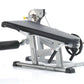TuffStuff Evolution plate load leg extension and prone leg curl bench with silver metal frame, black padded seat and backrest