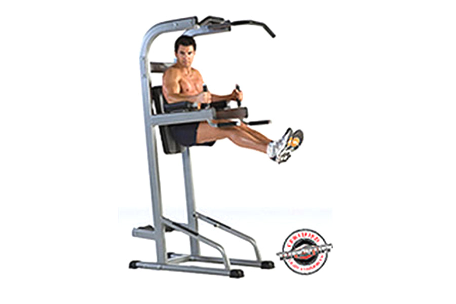 Gray steel vertical training tower with pull-up bar, dip station, and leg raise platform, shown with shirtless male model dem