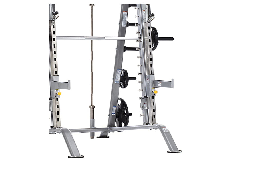 TuffStuff Evolution Smith Machine and half cage combo with gray steel frame, barbell, and weight plate storage on white backg
