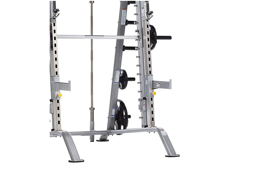 TuffStuff Evolution Smith Machine half cage combo with gray steel frame, barbell, weight plates, and safety handles on white 