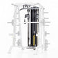 Smith machine with half cage frame, black uprights and rails, yellow safety stops, enclosed within white metal frame structur