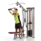 Man in neon yellow shirt using TuffStuff gray and burgundy multi-function weight machine for lat and row exercises against wh