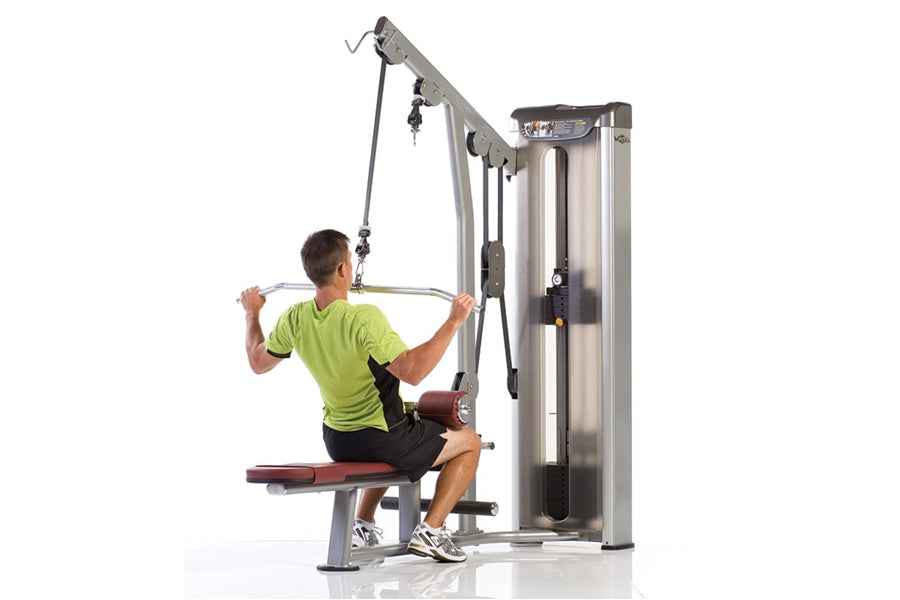 Man in green shirt using silver and burgundy cable row exercise machine with adjustable pulley system