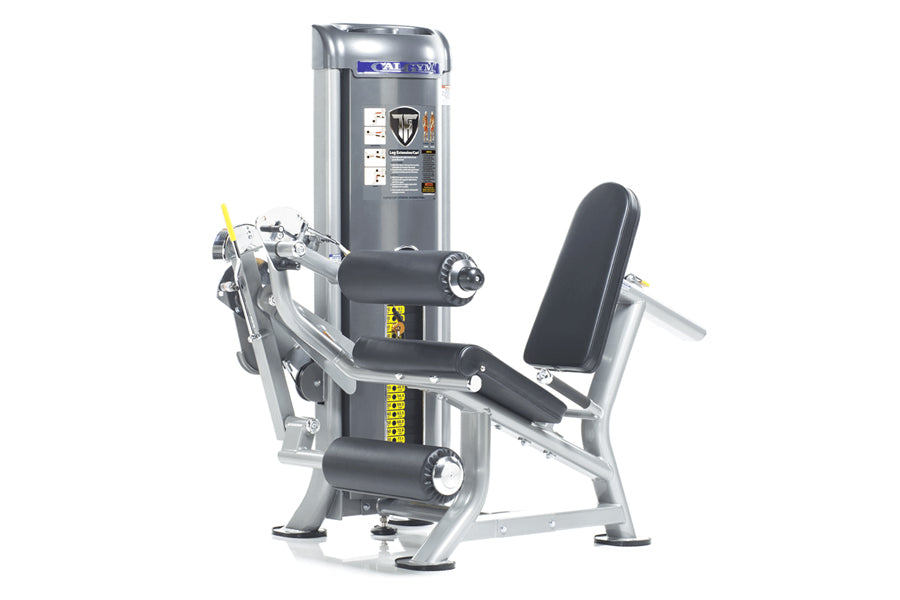 TuffStuff CalGym leg extension and curl machine with silver frame, black padded seat and backrest, and gray weight stack on w