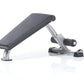 TuffStuff Mini Ab Bench with gray padded seat, silver metal frame, and black foot platform on white background