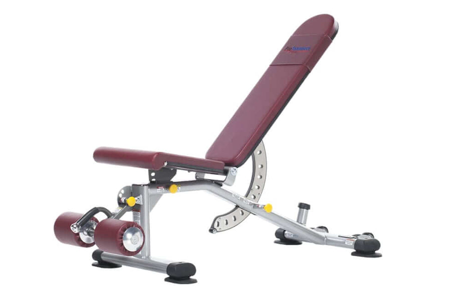 Burgundy and silver adjustable weight bench with leg extension attachment, yellow adjustment knobs, and black foot pads on wh