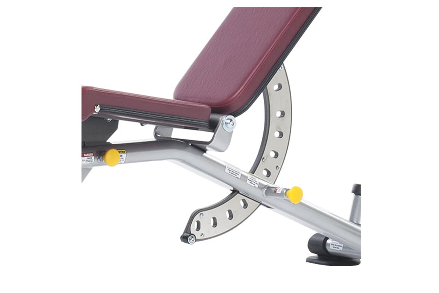 TuffStuff Proformance multi-adjustable weight bench with burgundy padded seat, silver metal frame, and yellow adjustment knob