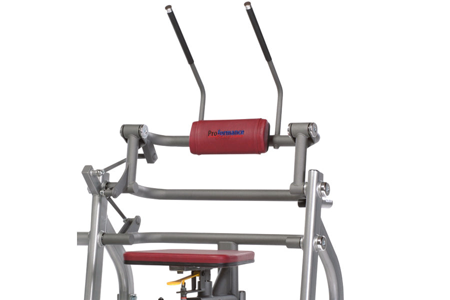 TuffStuff Proformance Plus abdominal crunch machine with gray metal frame, red padded seat and upper roller pad on white back