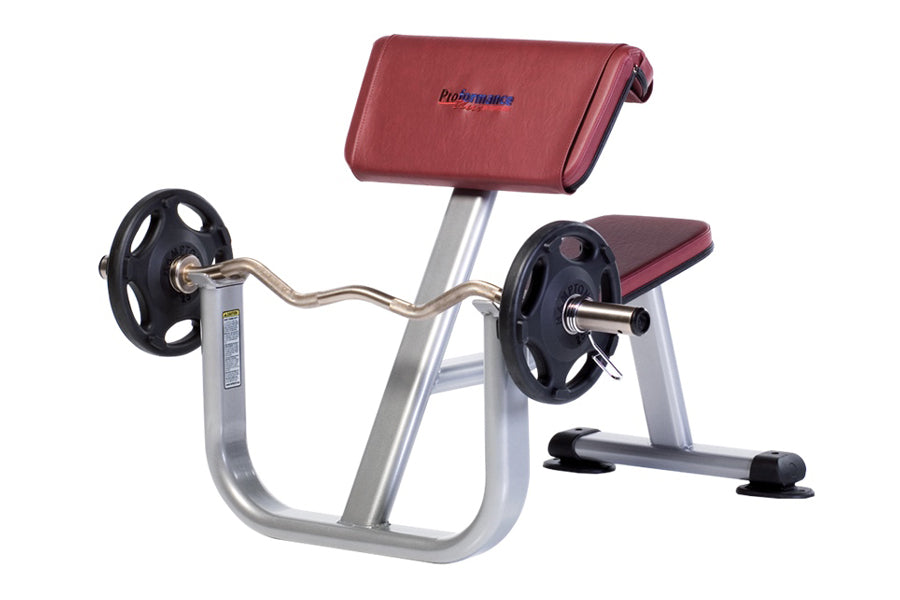 TuffStuff Proformance Plus preacher curl bench with burgundy pad, silver frame, curved barbell arms with black weight plates,