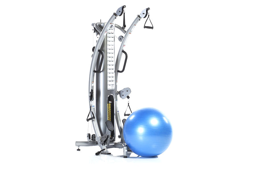 Silver and black functional trainer with dual cable towers, measurement scale, and multiple attachment points, displayed with