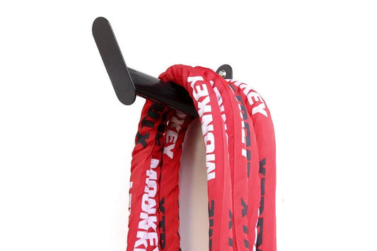 Red and white Warrior Undulation rope with black hanger hook on white background