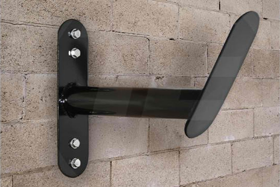 Black metal wall-mounted rope hanger with adjustable arm and chrome bolts, mounted on brick wall