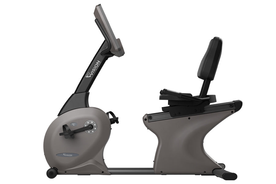 Gray and black recumbent exercise bike with adjustable seat, control console, and foot pedals on white background