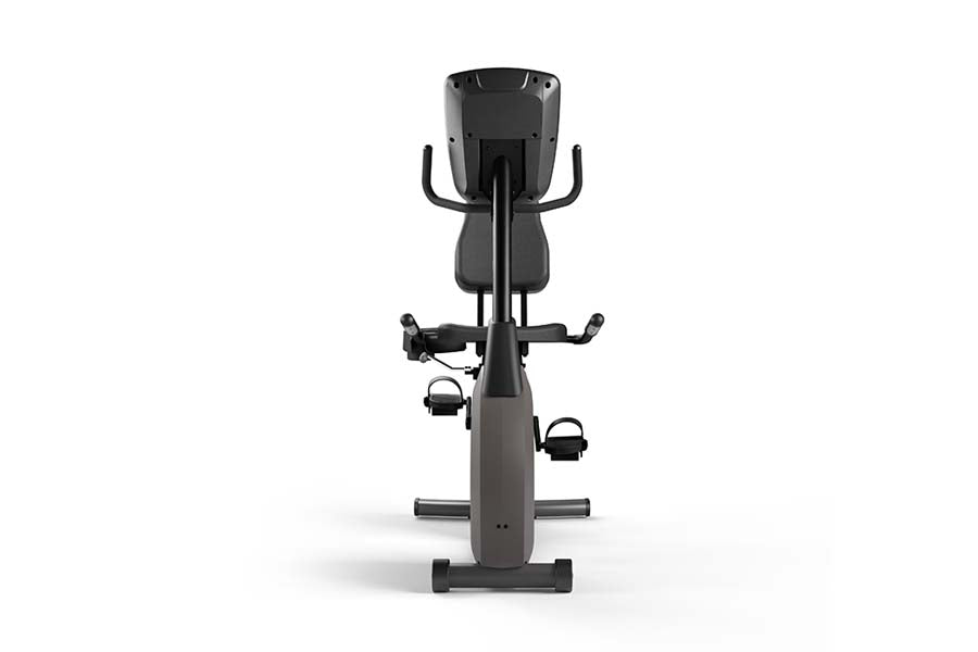 Stationary recumbent exercise bike with black and gray frame, padded seat, curved handlebars, foot pedals with straps, and di