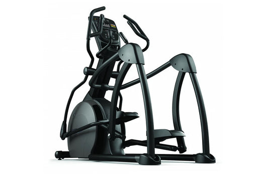 Black and gray elliptical fitness machine with digital console, dual handles, and foot pedals on white background