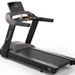 Black and gray Vision T600 light commercial treadmill with digital display console, dual handles, and textured running deck o