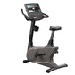 Upright exercise bike with gray and black frame, digital display console, black seat and handlebars, shown on white backgroun