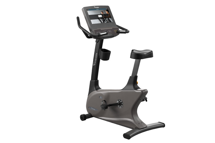 Upright exercise bike with gray and black frame, digital display console, black seat and handlebars, shown on white backgroun