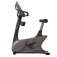 Vision U600E upright exercise bike with gray body, black handlebars and seat, digital console, and foot pedals on white backg