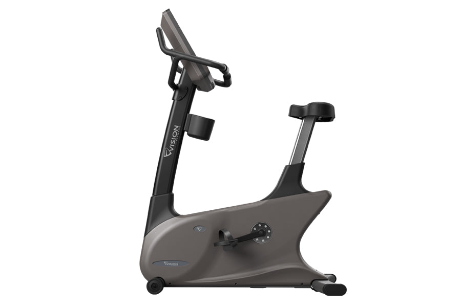 Vision U600E upright exercise bike with gray body, black handlebars and seat, digital console, and foot pedals on white backg