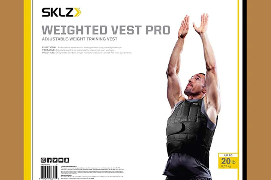 Black adjustable-weight training vest worn by male model with arms raised, up to 20 lbs capacity