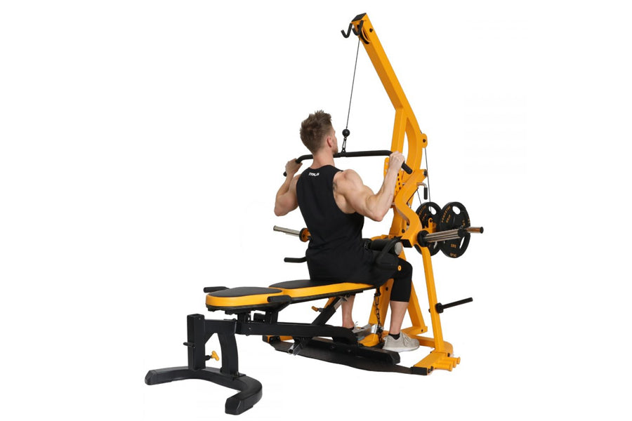 Yellow and black multi-station weight machine with pulley system, shown with male model demonstrating lat pull exercise on wh
