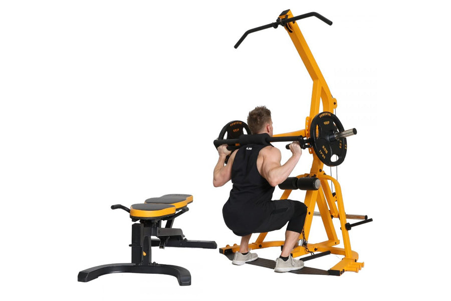 Yellow and black Powertec Levergym home gym machine with seated user performing shoulder press exercise, includes separate le