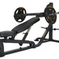 Black and gold Olympic barbell weight bench with leg extension attachment and loaded barbell plates on white background