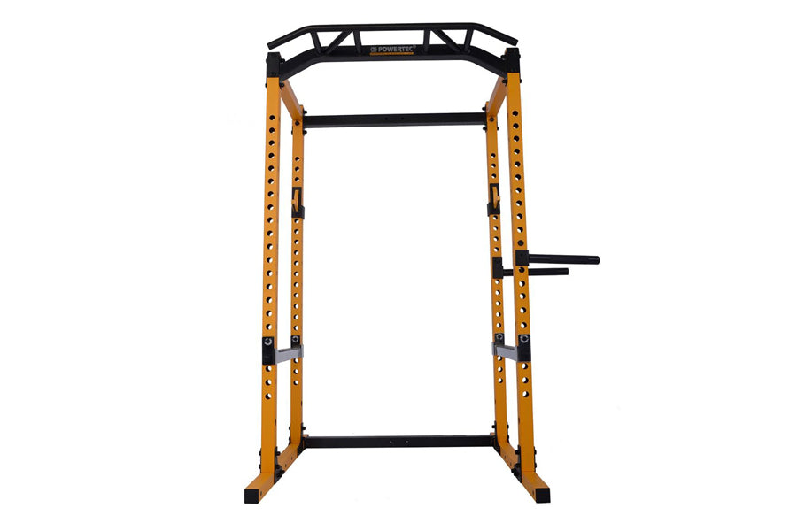 Black and yellow metal power rack with adjustable safety bars and j-hooks on white background