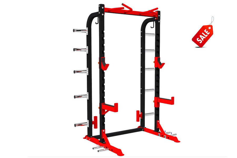 Warrior Elite 1.0 Squat Rack with red and black steel frame, adjustable safety bars, and multiple weight plate pegs on white 