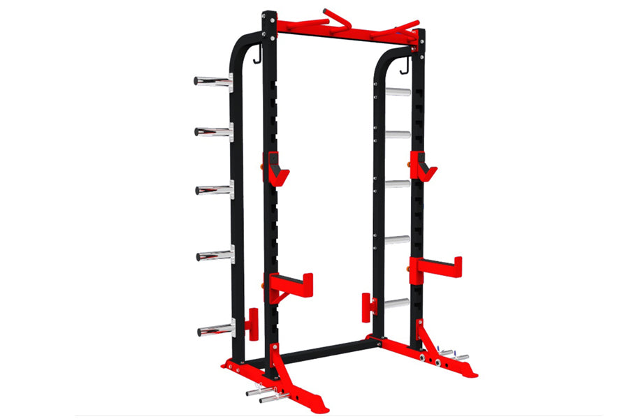 Black and red squat rack with adjustable safety bars, j-hooks, and dip attachment on white background