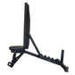 Black adjustable weight bench with padded seat and backrest, metal frame with leg extension attachment, on white background