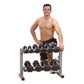 Warrior 2-tier horizontal dumbbell rack with black hexagonal weights, worn by shirtless male model on white background