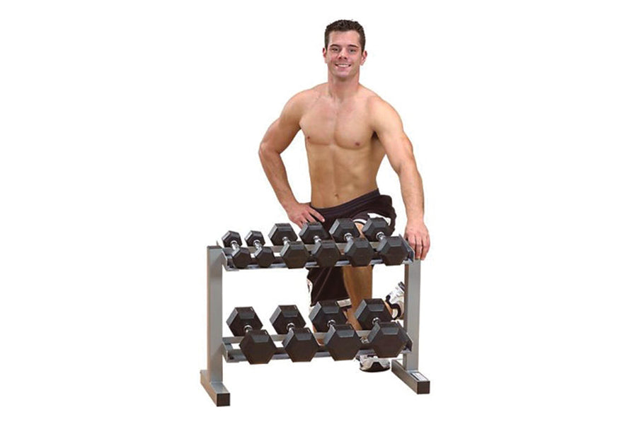 Warrior 2-tier horizontal dumbbell rack with black hexagonal weights, worn by shirtless male model on white background