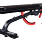 Black and red adjustable weight bench with padded seat, leg extension attachment, and incline mechanism on white background